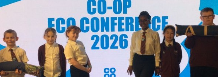 Children standing in front of a banner